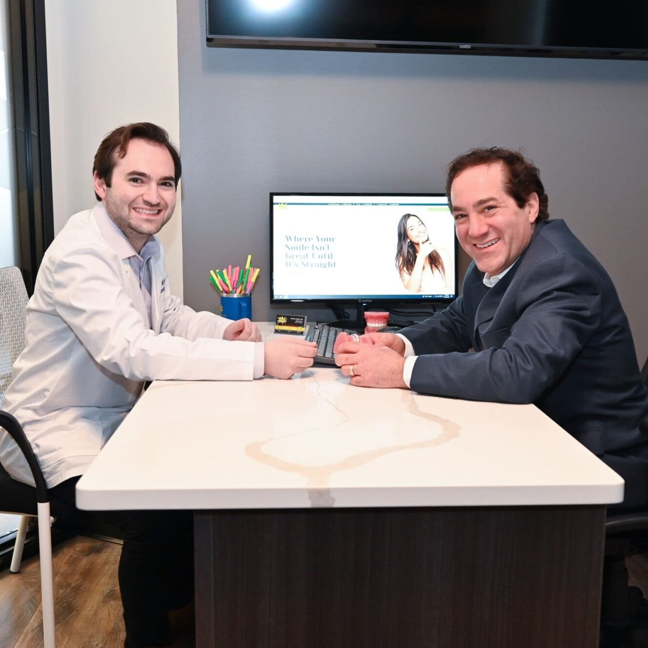 family at orthodontic appointment smiling