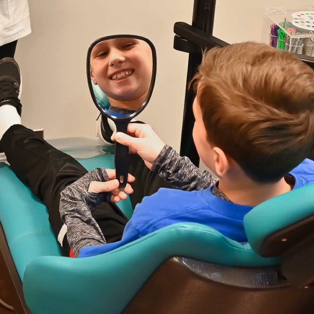 family at orthodontic appointment smiling